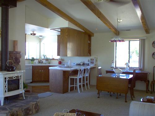 703 Poker Flat Road Copperopolis, CA 95228 - Photo 6 of 24 a view of a dining room with furniture and window