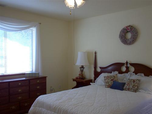 703 Poker Flat Road Copperopolis, CA 95228 - Photo 10 of 24 a bedroom with a bed and a window