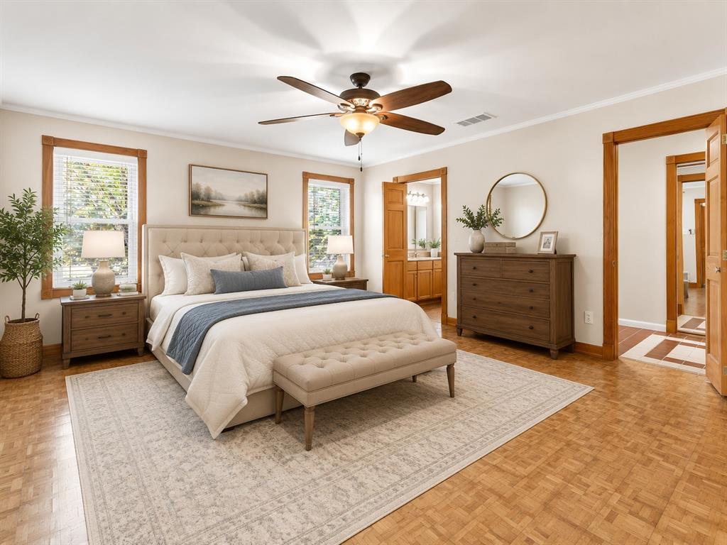 1900 South Duncanville Road Red Oak, TX 75154 - Photo 16 of 36 Virtually staged primary bedroom with ceiling fan and ensuite bathroom.