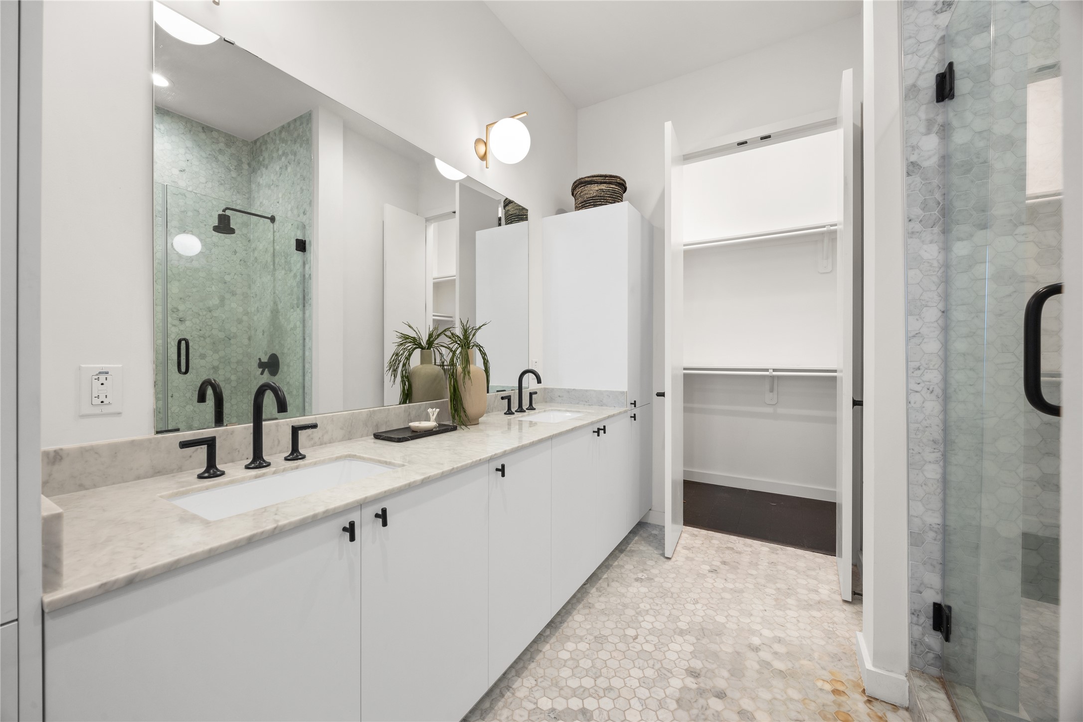 800 Embassy Drive, Unit 602 Austin, TX 78702 - Photo 14 of 37 Dual vanity with stone countertops and matte black fixtures