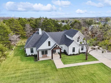a aerial view of a house with a big yard