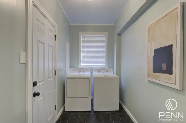 a kitchen with a refrigerator and a sink