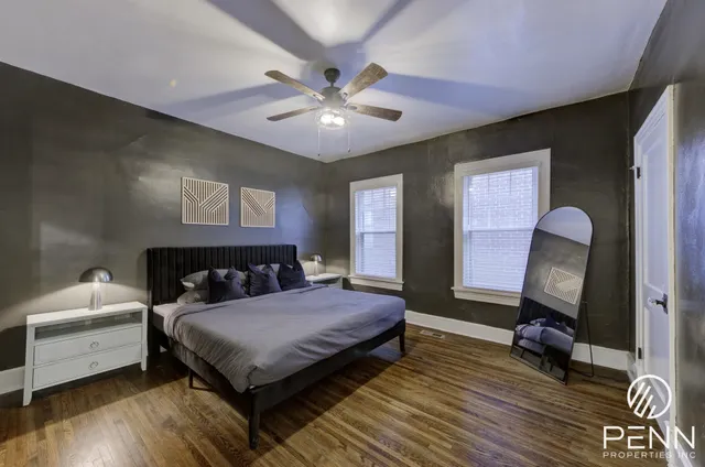 a kitchen with stainless steel appliances kitchen island granite countertop a sink and a refrigerator