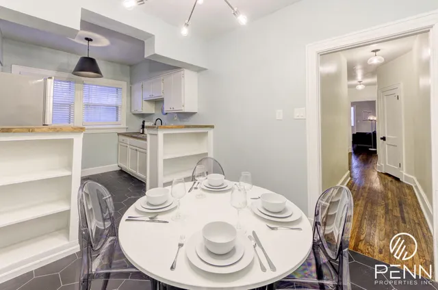 a kitchen with stainless steel appliances a sink stove and cabinets