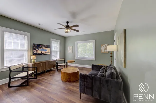 a living room with furniture and a window