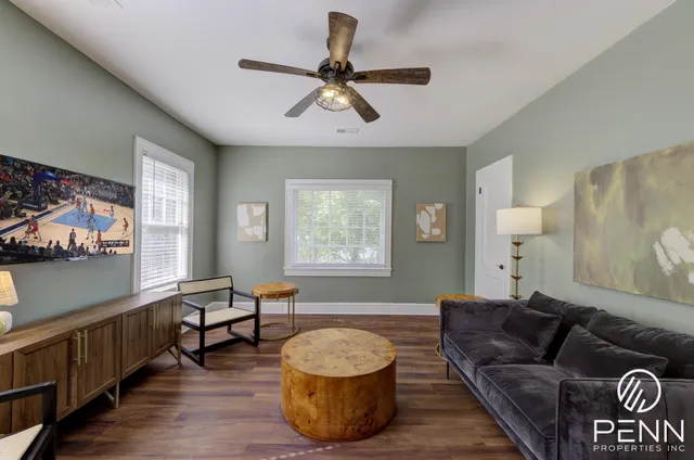 a view of room with a window and wooden floor