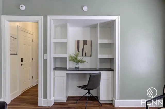 a bathroom with a sink toilet and a mirror
