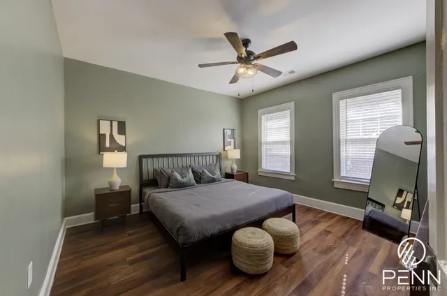 wooden floor and chandelier fan in a room