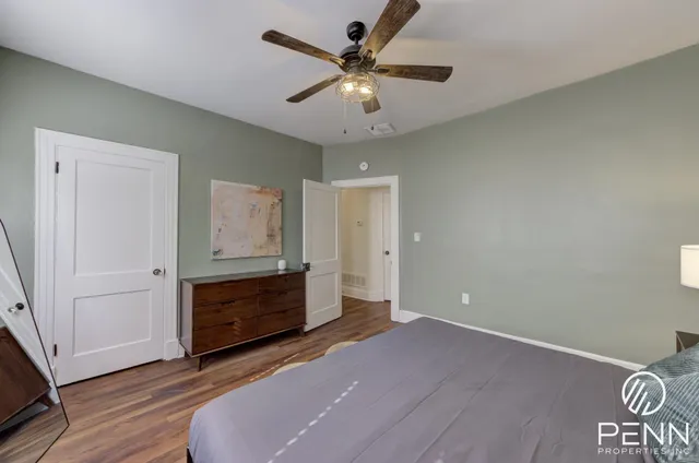 a view of a dining room with furniture and a flat screen tv