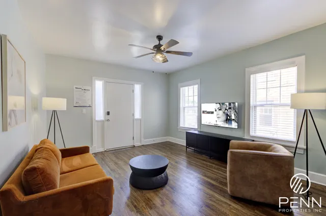 a living room with furniture and a window