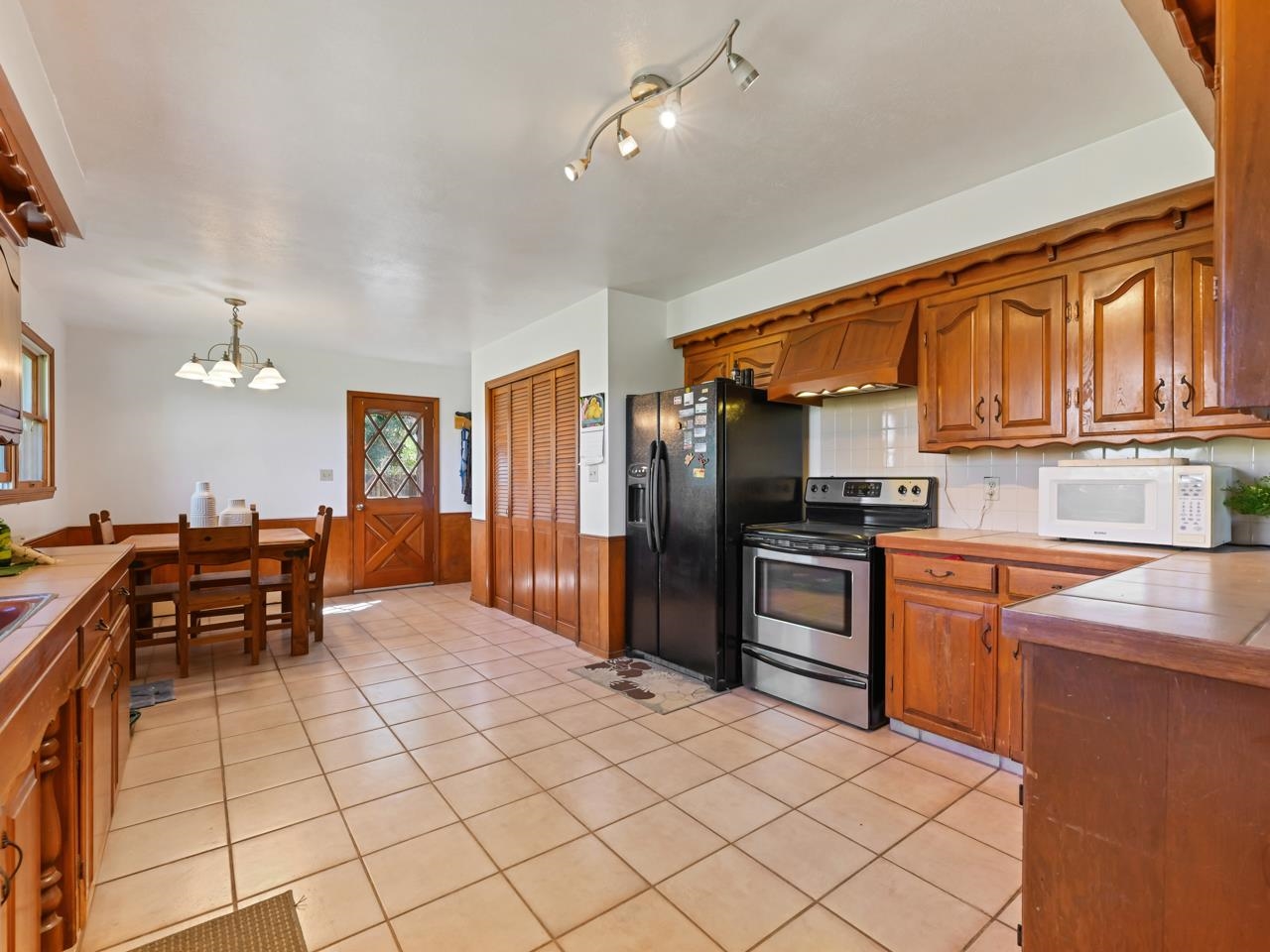 3418 F Road Clifton, CO 81520 - Photo 9 of 41 a kitchen with stainless steel appliances granite countertop a refrigerator and stove top oven