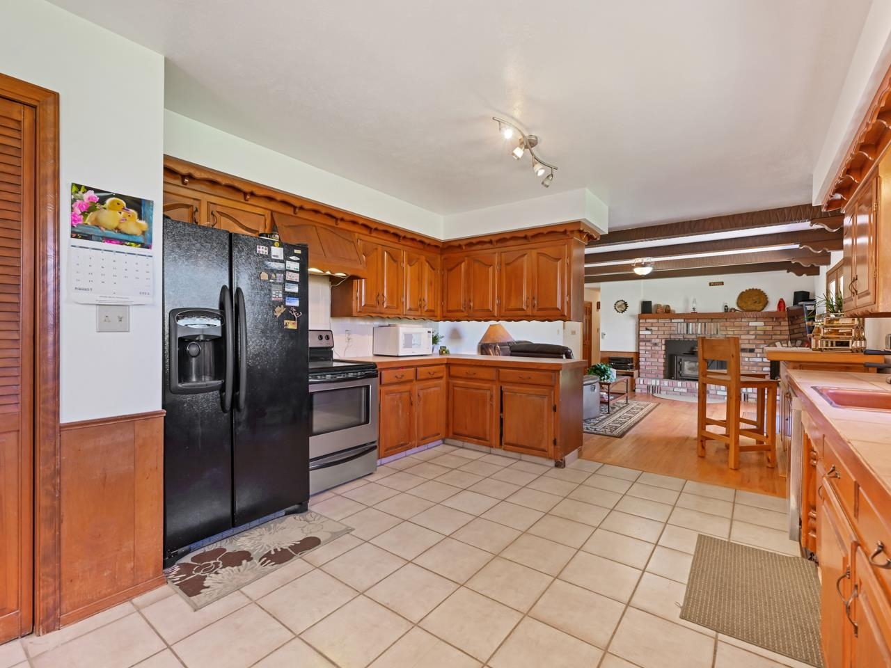 3418 F Road Clifton, CO 81520 - Photo 10 of 41 a kitchen with stainless steel appliances granite countertop a refrigerator and a sink