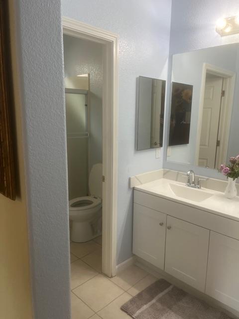 812 Vía Rosa Los Banos, CA 93635 - Photo 16 of 18 a bathroom with a double vanity sink and mirror