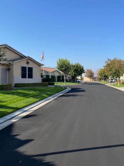 812 Vía Rosa Los Banos, CA 93635 - Photo 3 of 18 a view of a house with a yard and a garage