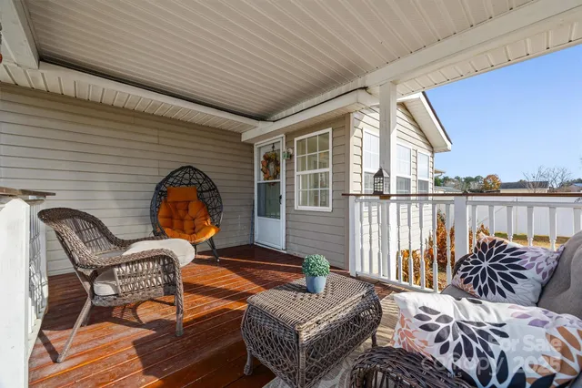 a outdoor space with patio the couches and chairs with wooden floor
