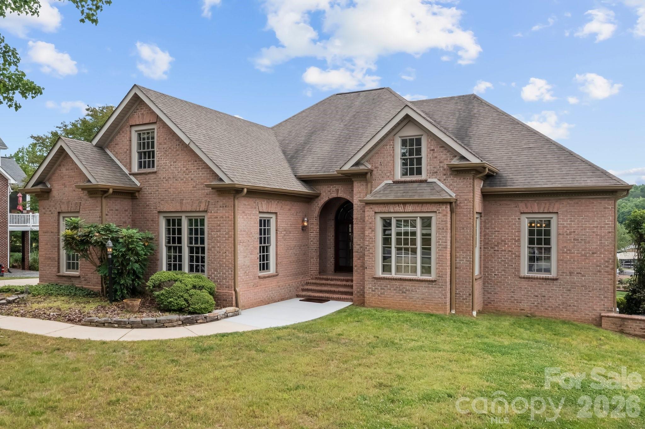a front view of a house with a yard