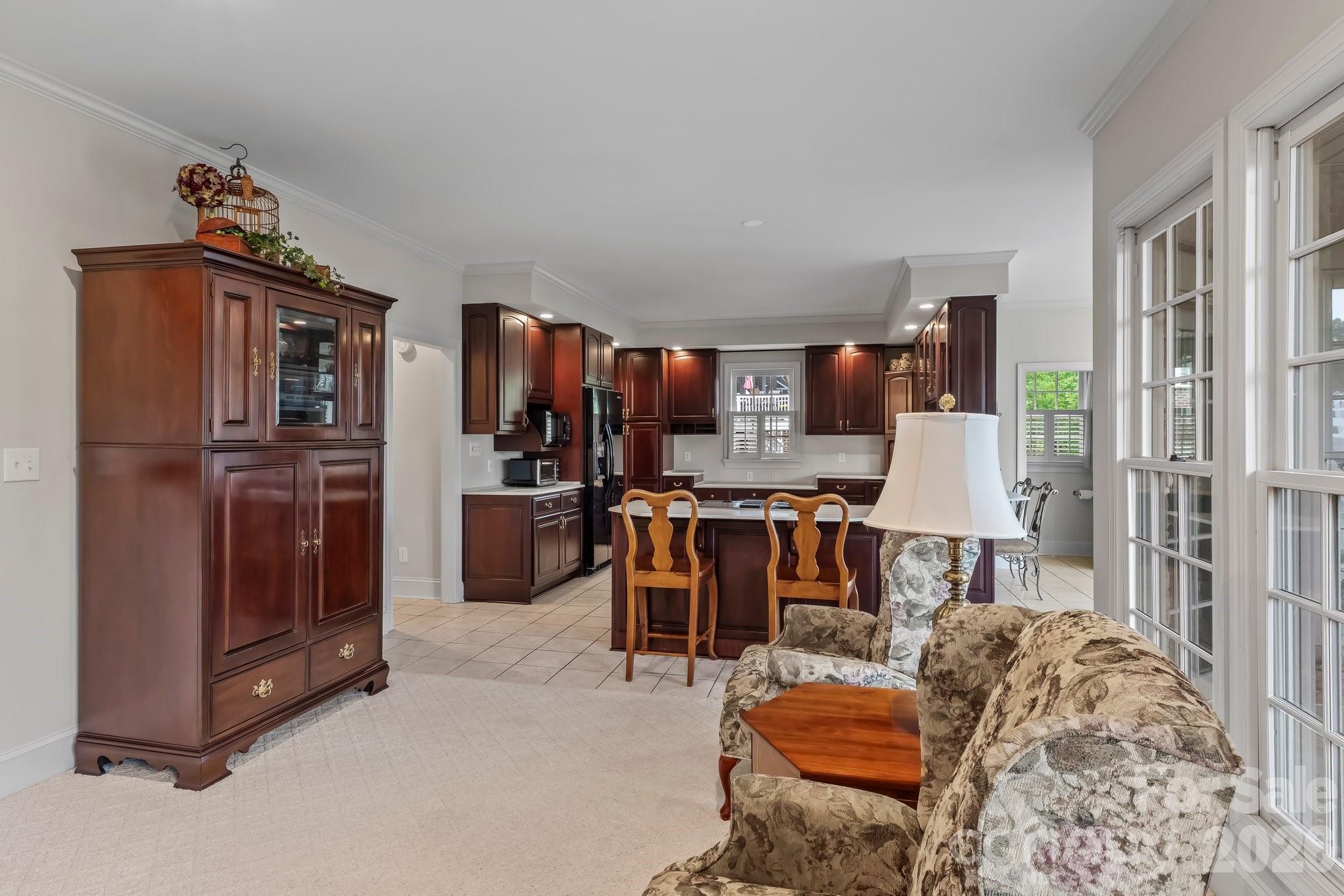 221 Windemere Isle Road Statesville, NC 28677 - Photo 11 of 42 a living room with furniture and a kitchen