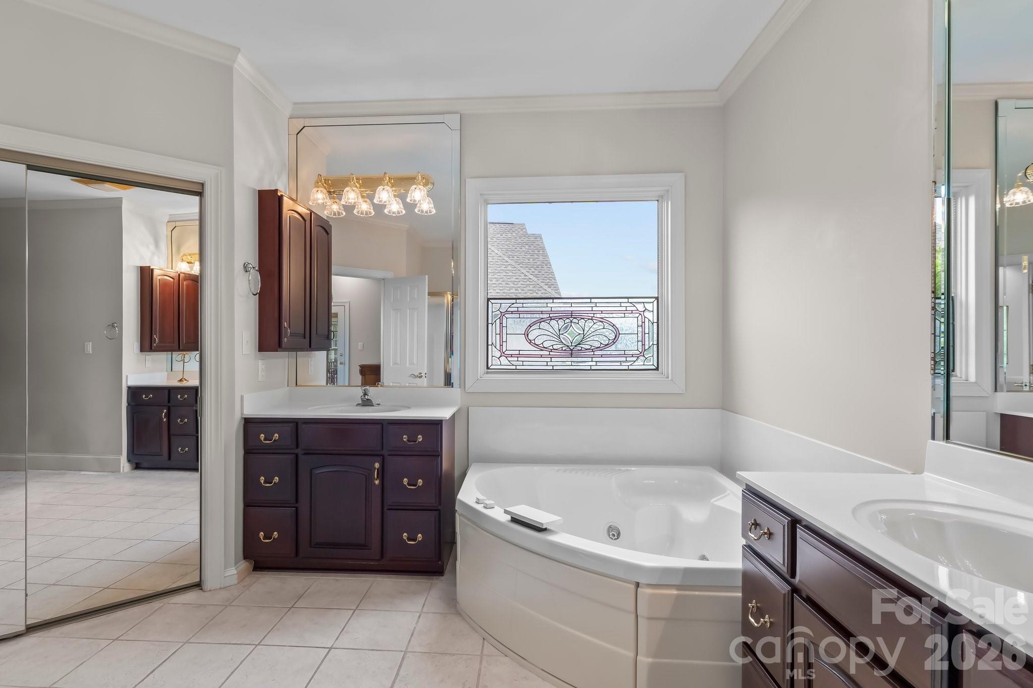 221 Windemere Isle Road Statesville, NC 28677 - Photo 15 of 42 a spacious bathroom with a tub sink and mirror