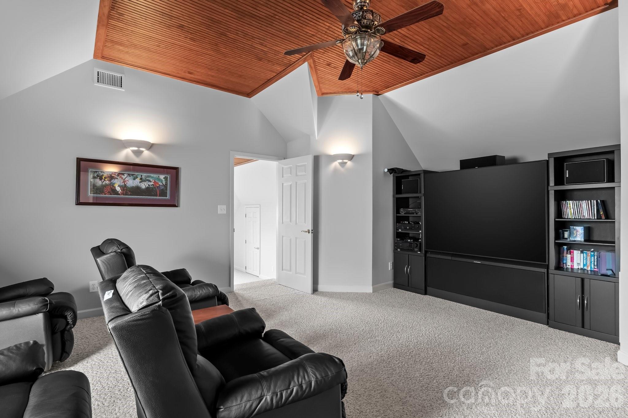 221 Windemere Isle Road Statesville, NC 28677 - Photo 19 of 42 a living room with furniture and a flat screen tv