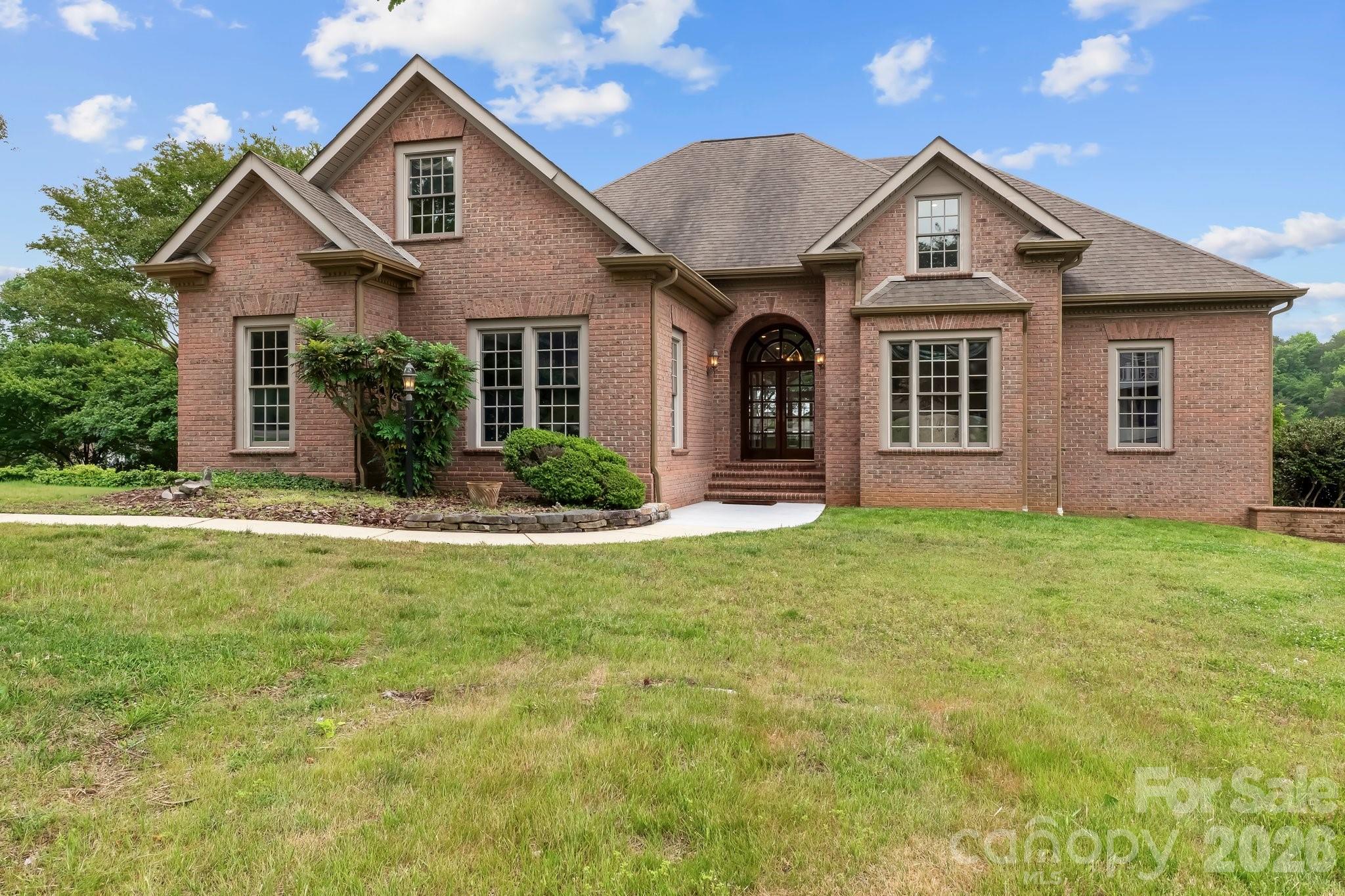 221 Windemere Isle Road Statesville, NC 28677 - Photo 2 of 42 a front view of a house with a yard