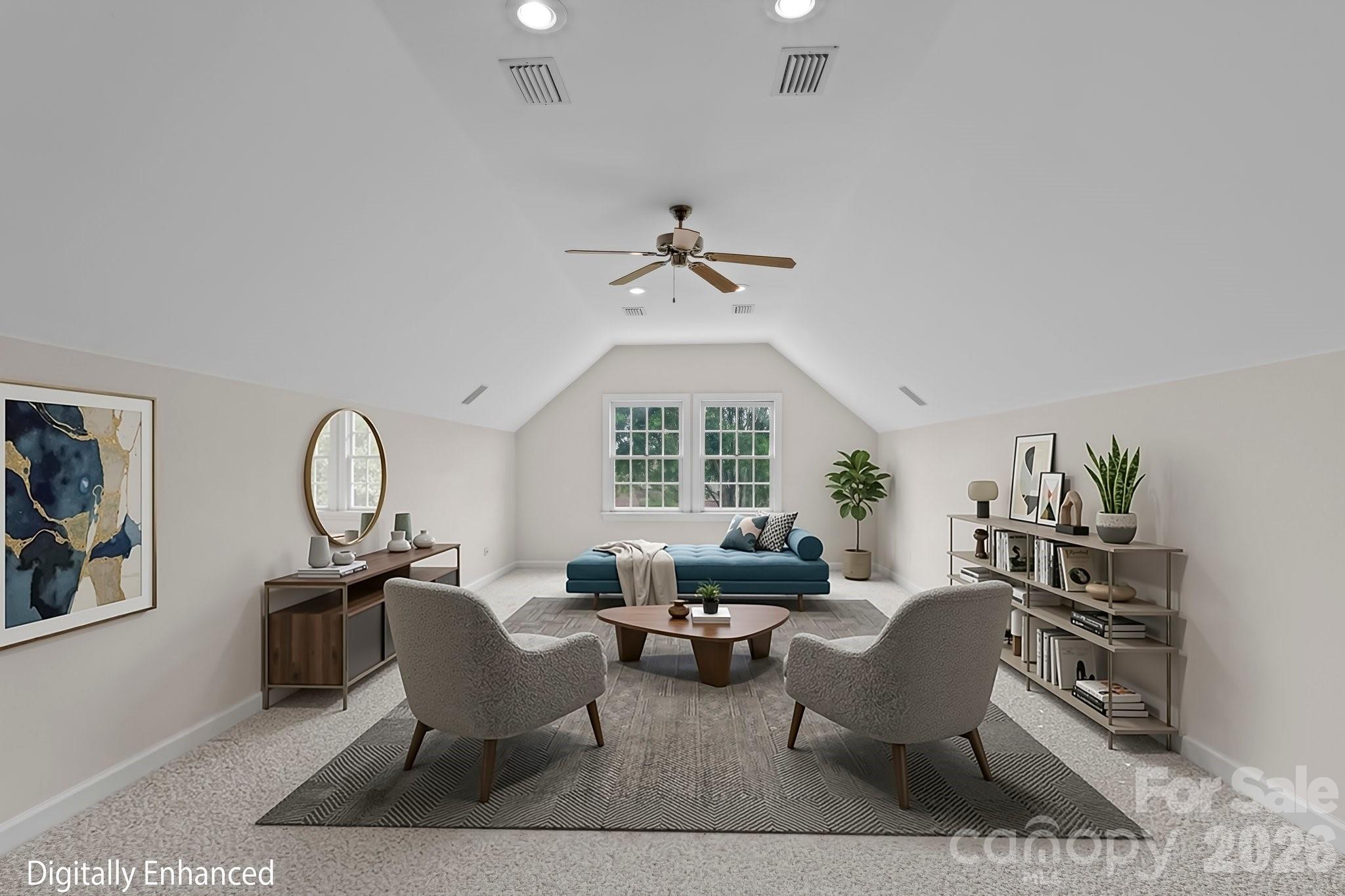 221 Windemere Isle Road Statesville, NC 28677 - Photo 22 of 42 a living room with furniture a rug and a chandelier