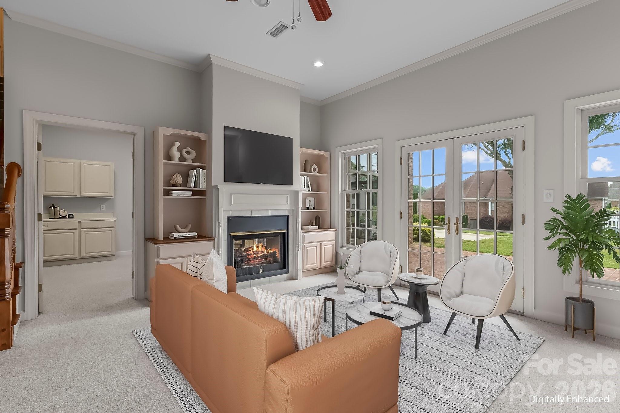 221 Windemere Isle Road Statesville, NC 28677 - Photo 28 of 42 a living room with furniture fireplace and a flat screen tv
