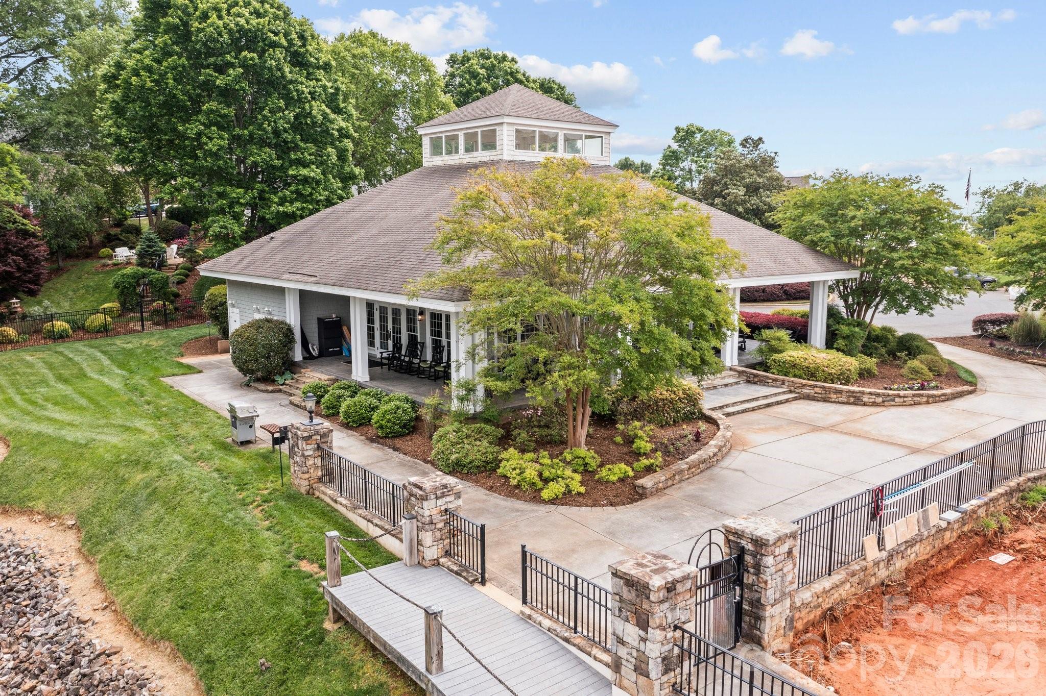 221 Windemere Isle Road Statesville, NC 28677 - Photo 37 of 42 a front view of a house with a yard and potted plants