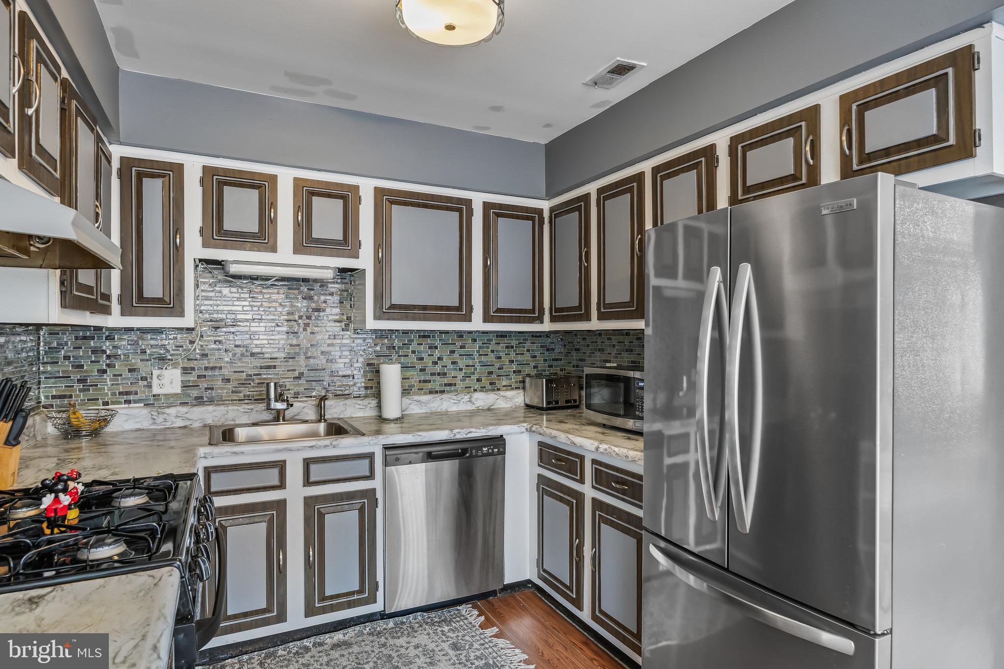 51 Blue Spruce Court Lumberton, NJ 08048 - Photo 9 of 28 a kitchen with stainless steel appliances granite countertop a refrigerator sink and stove