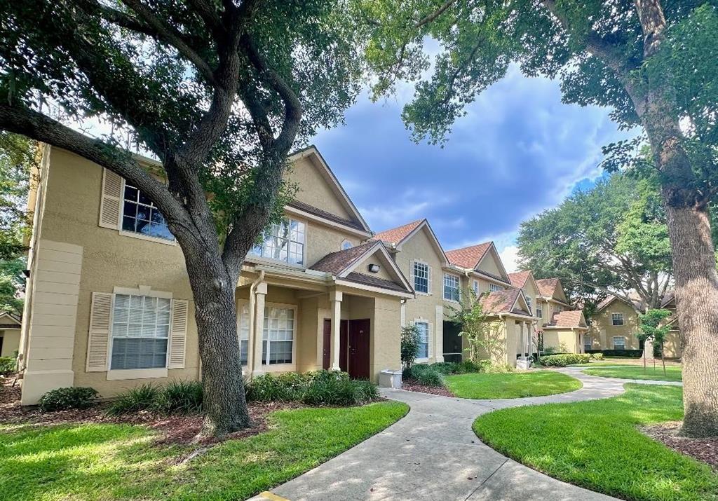 822 Grand Regency Pointe, Unit 203 Altamonte Springs, FL 32714 - Photo 1 of 1 front view of a house with a yard