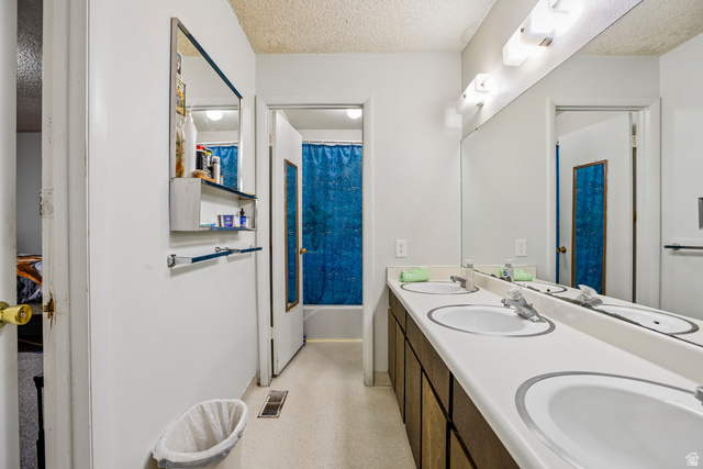 768 300 North Provo, UT 84606 - Photo 32 of 51 Double vanity with white oval sinks, chrome faucets, and integrated countertop