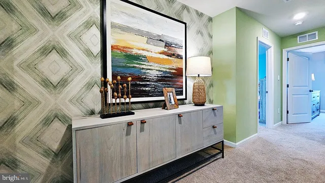 a kitchen with stainless steel appliances cabinets and a large window