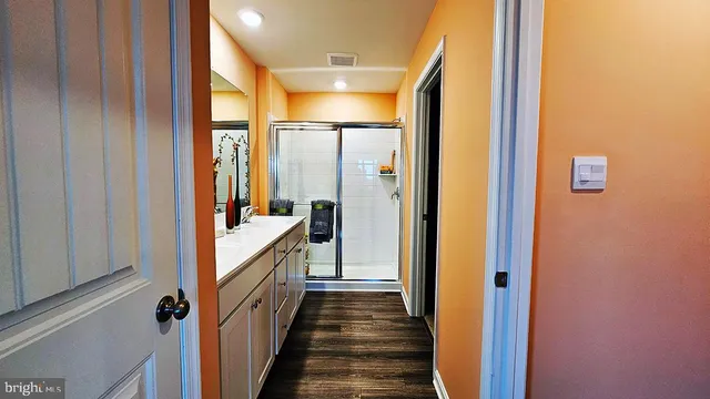a bathroom with a double vanity sink and a mirror