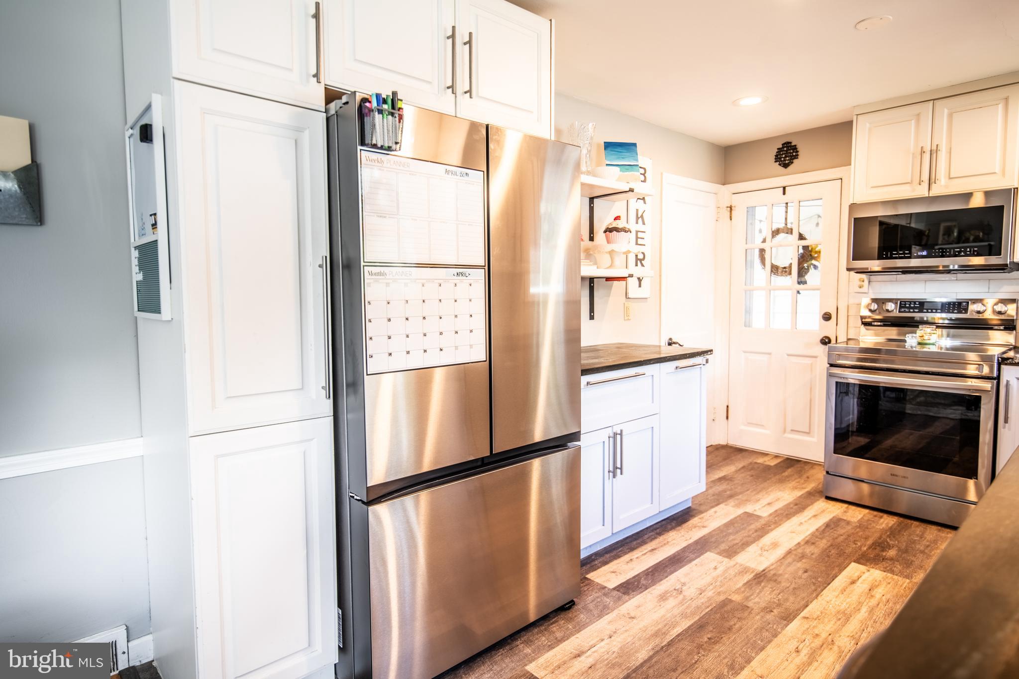 141 Cascade Road Springfield, PA 19064 - Photo 11 of 29 a kitchen with stainless steel appliances a refrigerator sink and microwave