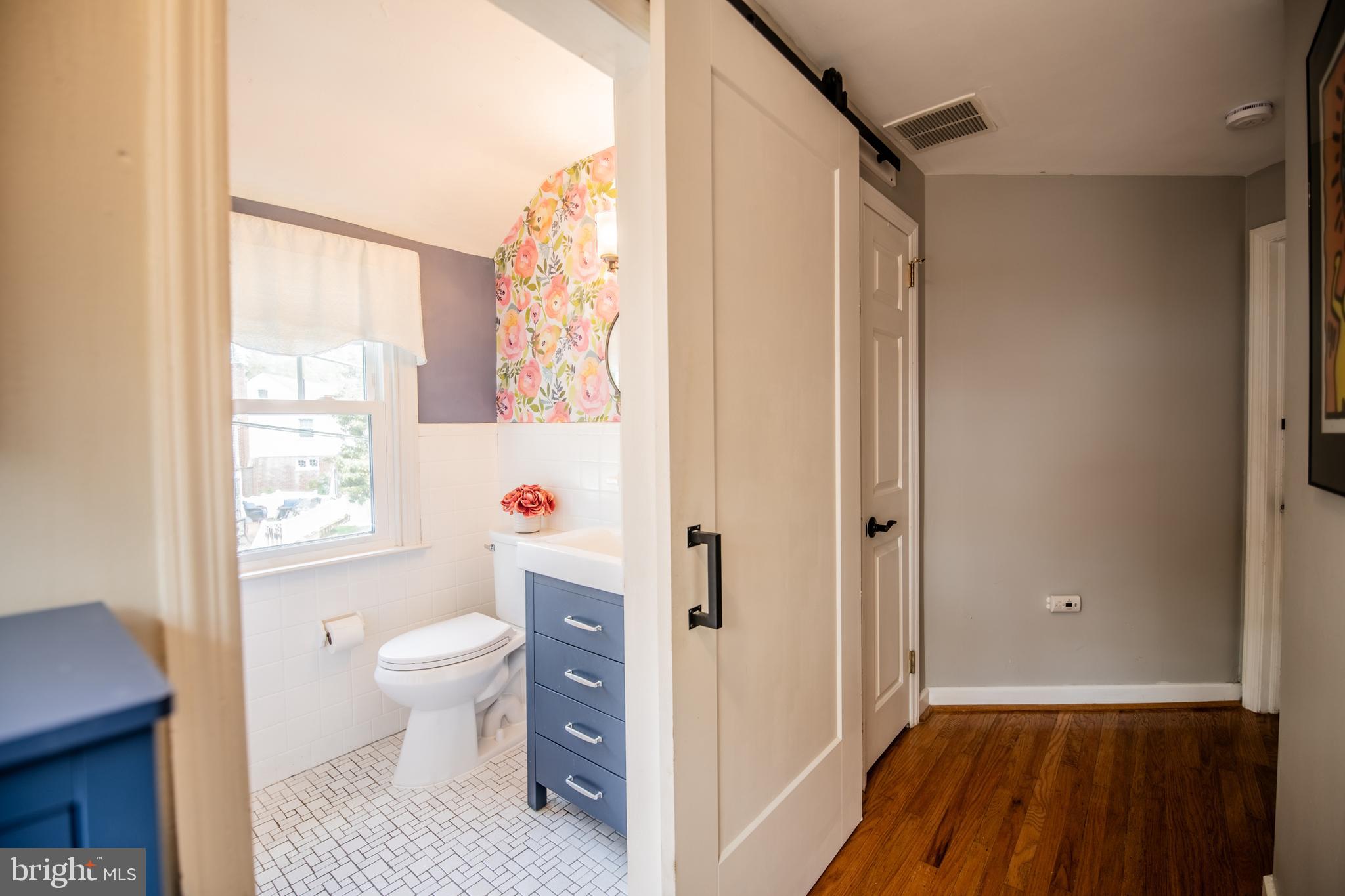141 Cascade Road Springfield, PA 19064 - Photo 20 of 29 a view of bathroom with a toilet potted plant and a window