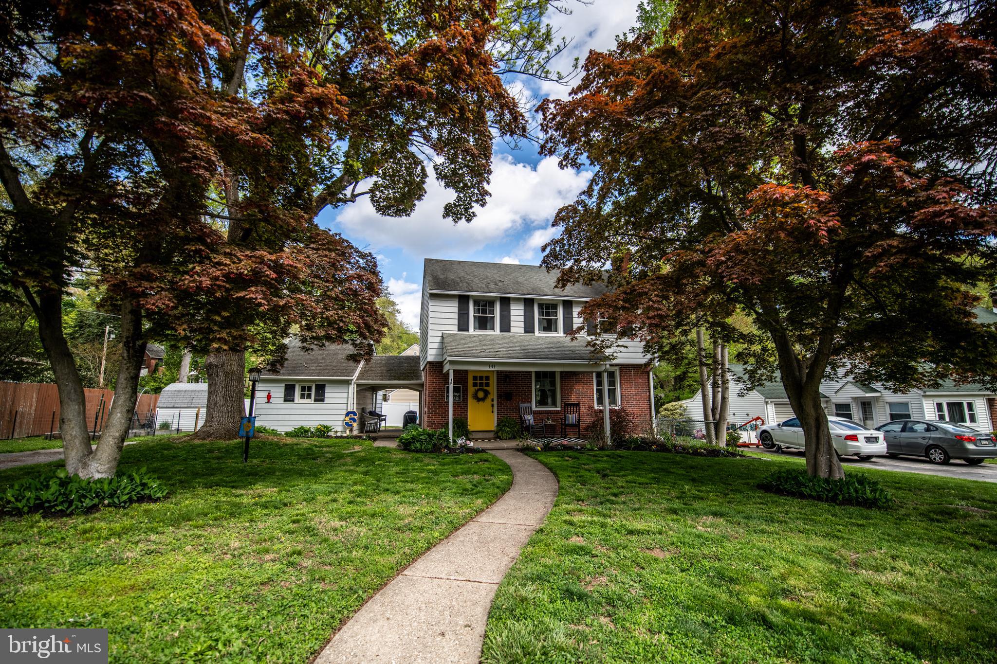 141 Cascade Road Springfield, PA 19064 - Photo 3 of 29 a front view of a building with a garden
