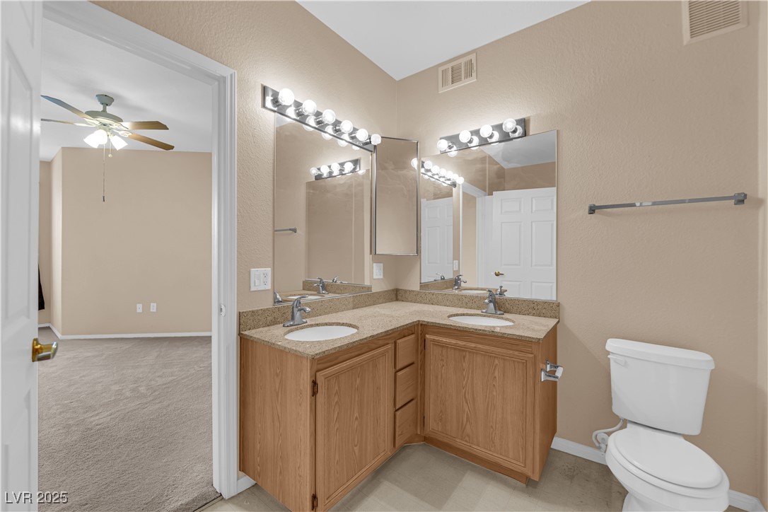 10550 West Alexander Road, Unit 2233 Las Vegas, NV 89129 - Photo 19 of 35 Full bathroom with a ceiling fan, visible vents, and a sink