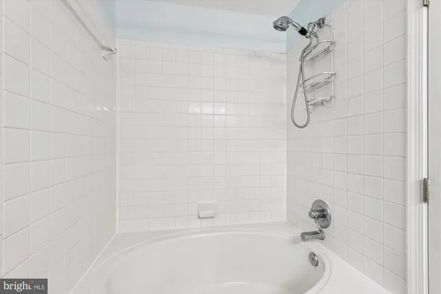 a bathroom with a shower and a bathtub