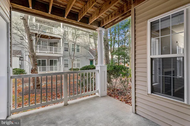 a view of a brick house with large windows