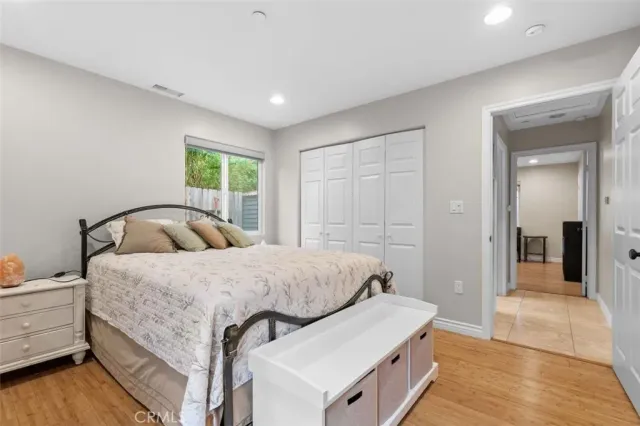 a bedroom with a bed and a dresser