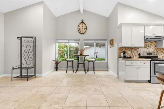 a view of a kitchen with furniture and a window