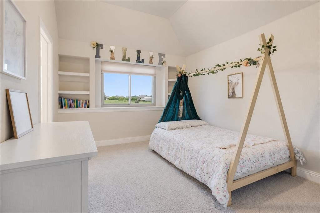 1205 Redbud Street Howe, TX 75459 - Photo 28 of 40 a bedroom with a bed and a window