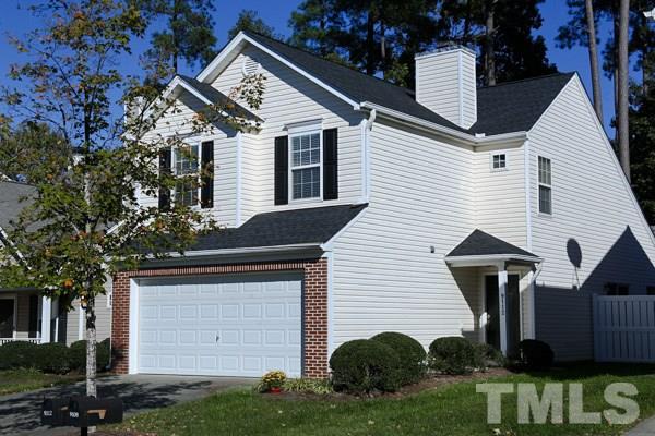 9112 Shallcross Way Raleigh, NC 27617 - Photo 2 of 16 a front view of a house with a yard and garage