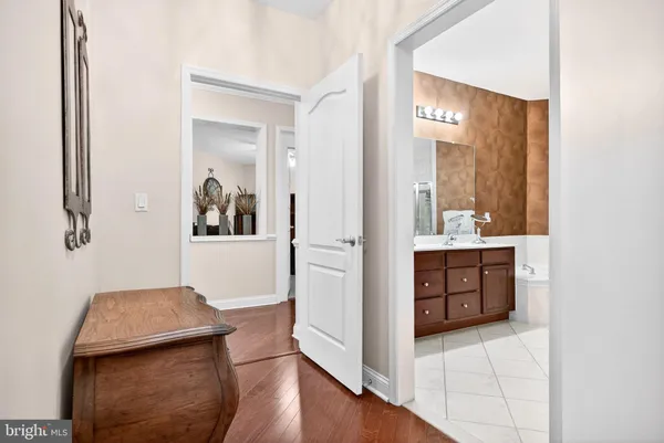a bathroom with a sink a mirror and a vanity