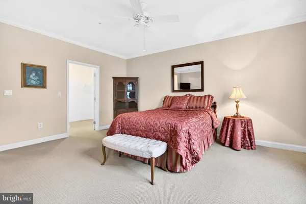 a bedroom with a bed and a lamp