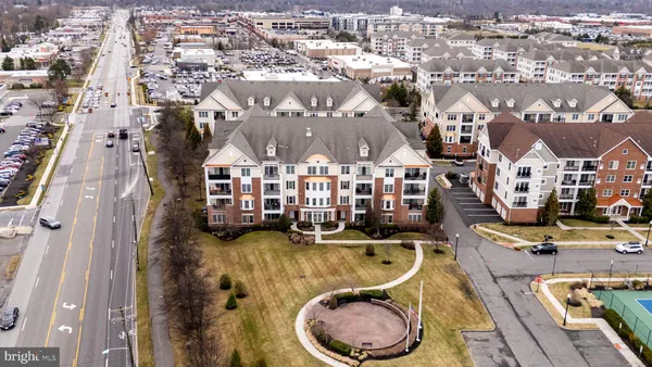 an aerial view of residential house with outdoor space and swimming pool