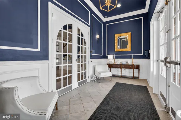 a view of front door of house with stairs