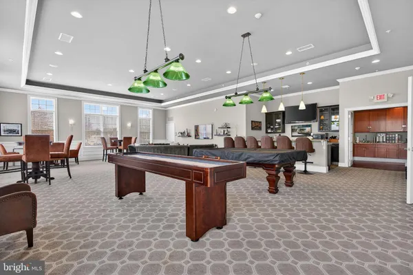 a group of people sitting in a living room
