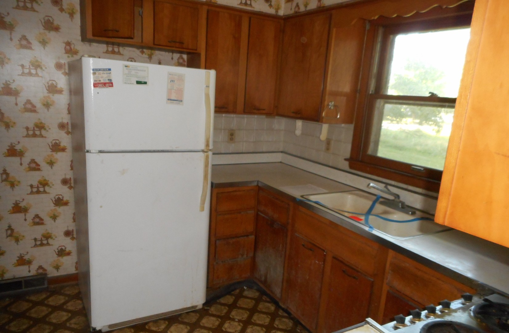 186 Alfred Drive Sycamore, IL 60178 - Photo 5 of 15 a white refrigerator freezer sitting inside of a kitchen