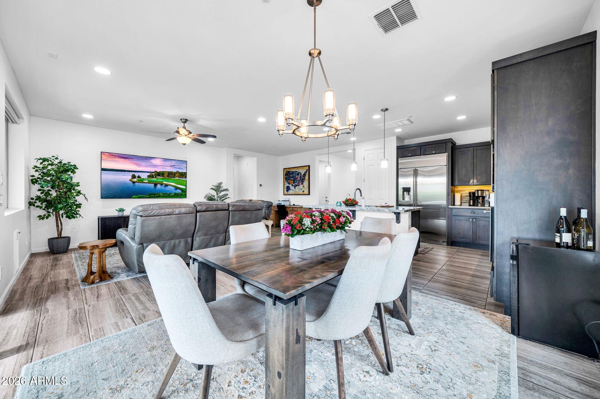 17983 East Vista Desierto Rio Verde, AZ 85263 - Photo 12 of 30 a view of a dining room with furniture and wooden floor