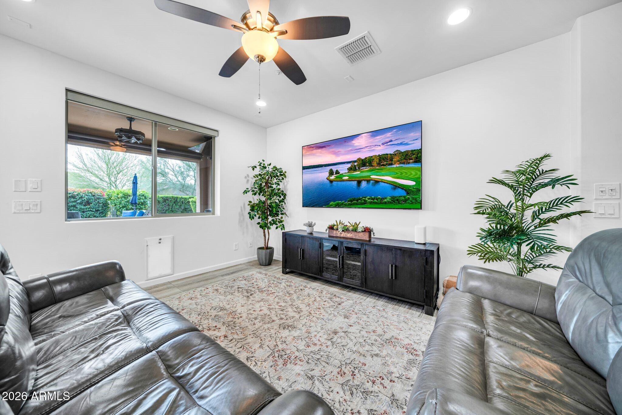 17983 East Vista Desierto Rio Verde, AZ 85263 - Photo 14 of 30 a living room with furniture and a flat screen tv